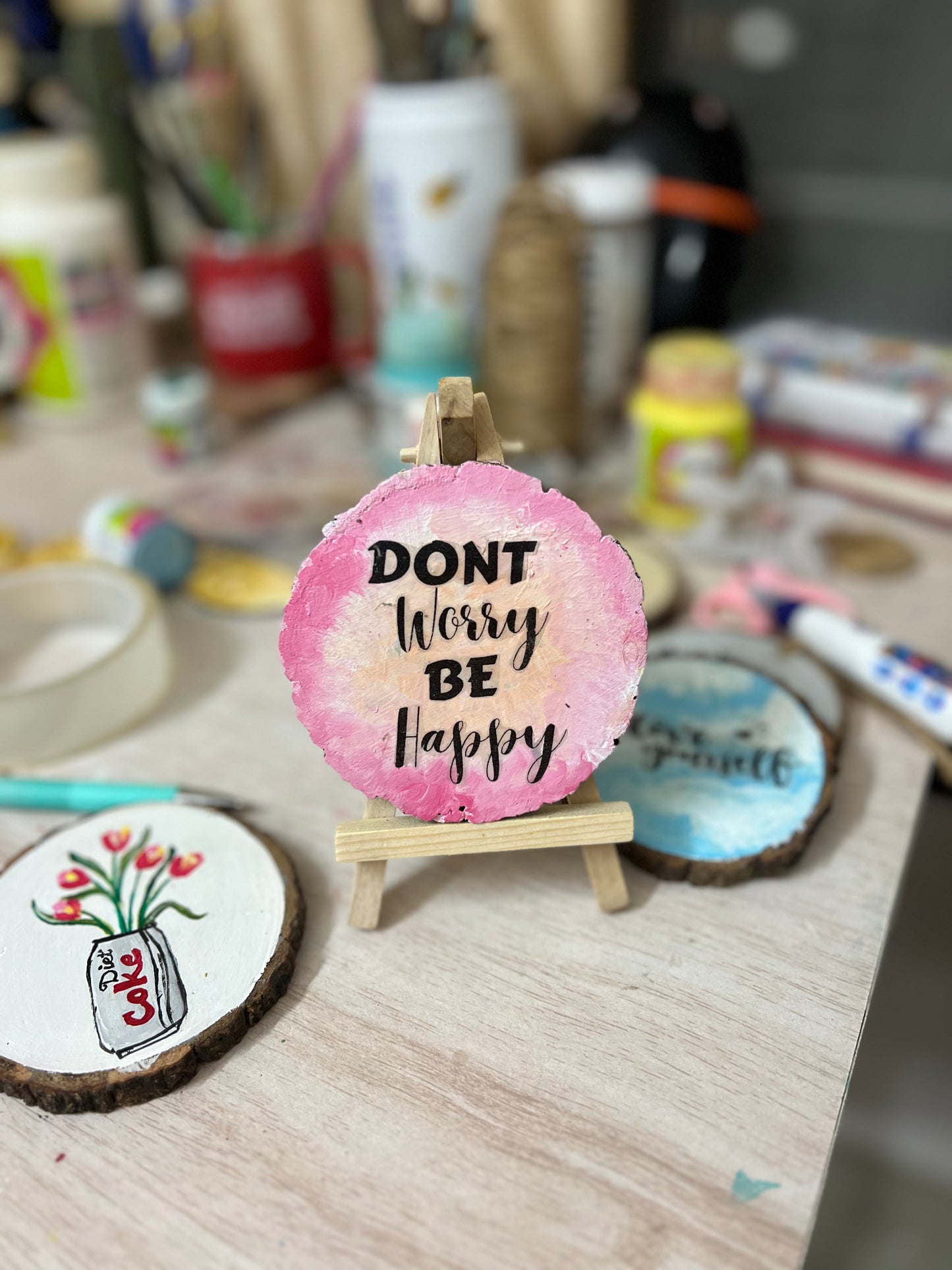 Don’t worry Be happy - painted wood log with stand