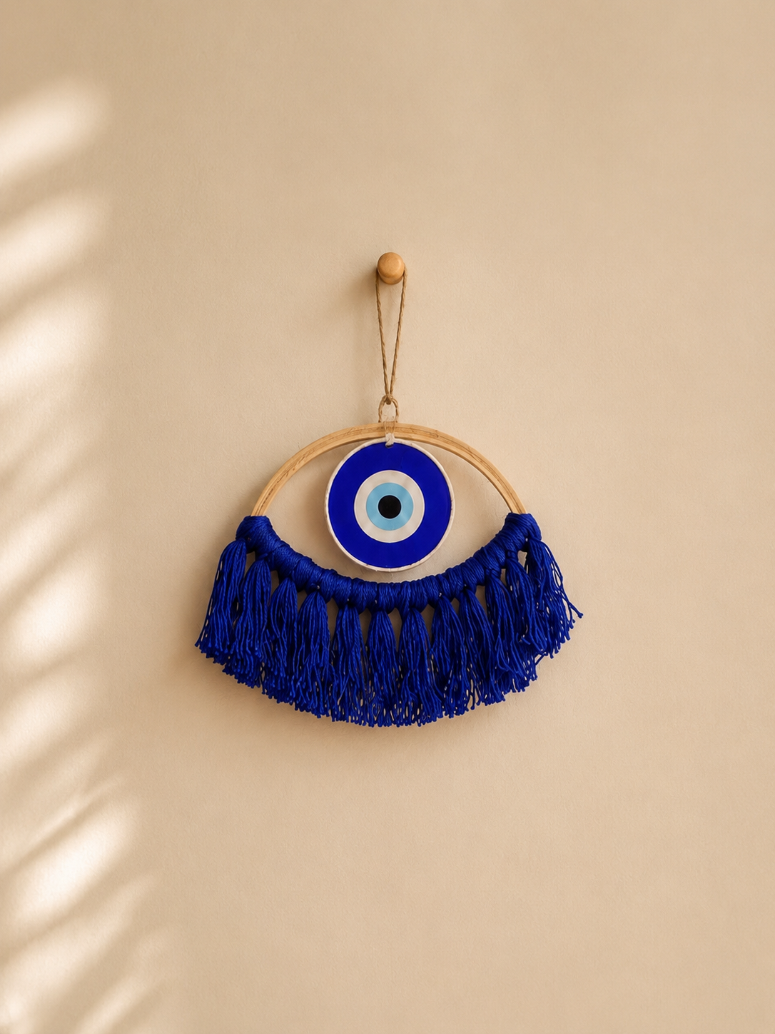 Blue little evil eye with macrame